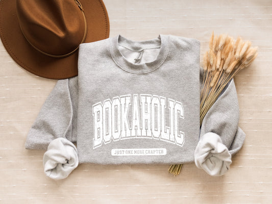 Bookaholic Just One More Chapter Cozy Unisex Crewneck Sweatshirt - Perfect for Casual Outings, Lounging at Home, Holiday Gifts, and Everyday Wear