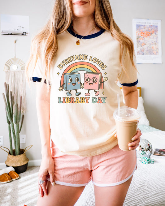 Whimsical Library Day T-Shirt, Cute Graphic Tee, Book Lover Gift, Unisex Cotton Shirt, Fun Reading Apparel, Perfect for Library Events